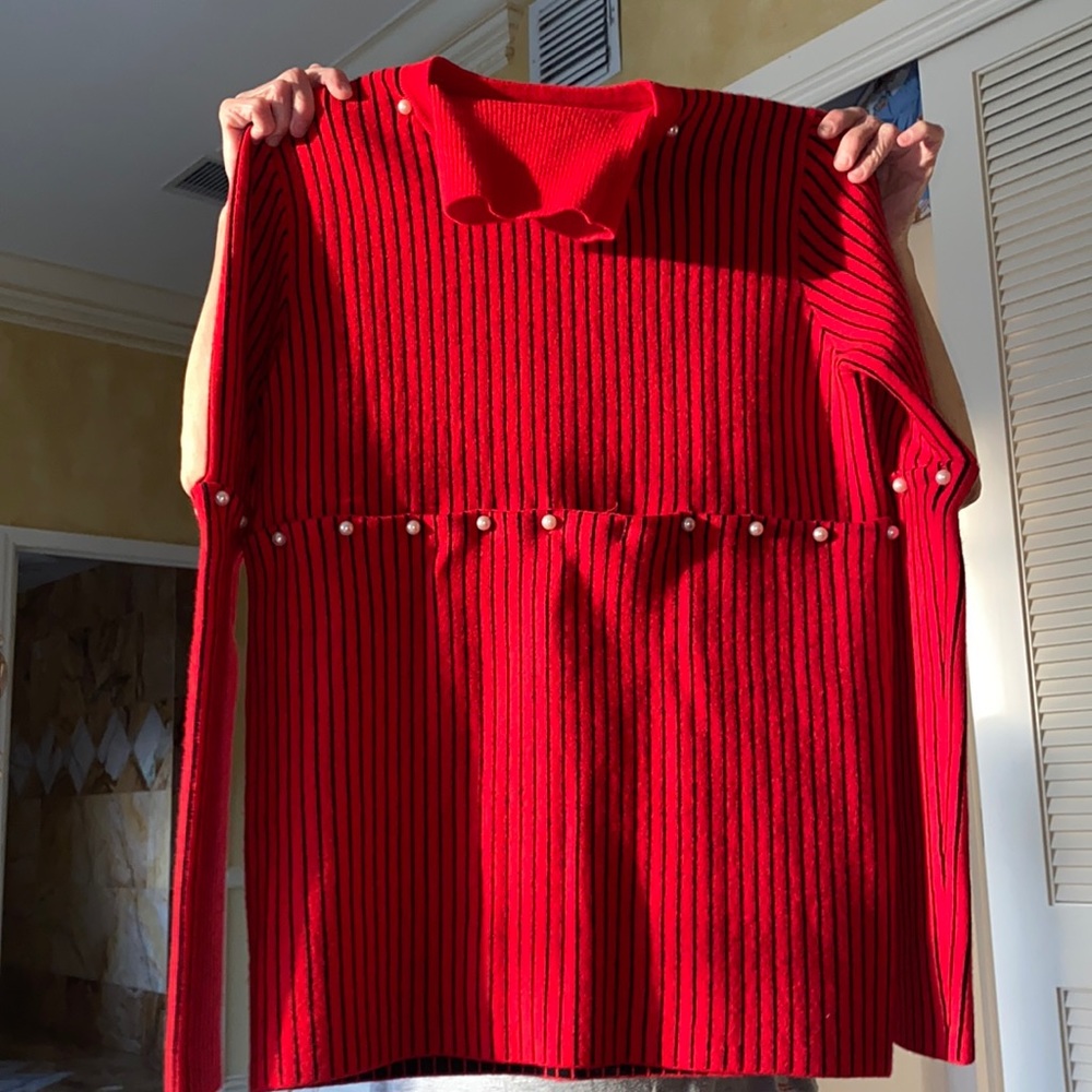 Red sweater with black stripes.Detachable sleeves!